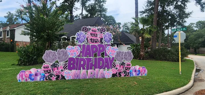 Photo-ready celebration yard sign installed before the event